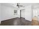 Bright bedroom features wood-look flooring, white walls, and a closet for ample storage at 3918 W Fig St, Tampa, FL 33609