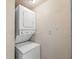 This laundry area features a stacked washer and dryer for space-saving convenience at 3918 W Fig St, Tampa, FL 33609
