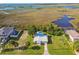 Aerial view of a waterfront home with expansive marsh views at 4021 Eagle Nest Dr, Hernando Beach, FL 34607