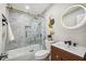 Spa-like bathroom with marble tile, a glass shower, and modern vanity at 4021 Eagle Nest Dr, Hernando Beach, FL 34607