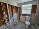Under construction bathroom with exposed plumbing and tile floor at 4021 Eagle Nest Dr, Hernando Beach, FL 34607