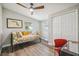 Cozy bedroom with a daybed, built-in closet, and wood-look flooring at 4021 Eagle Nest Dr, Hernando Beach, FL 34607