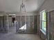 Home interior with new light fixture and exposed framing during renovation at 4021 Eagle Nest Dr, Hernando Beach, FL 34607