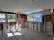 Interior room during remodel; framing, windows, and flooring visible at 4021 Eagle Nest Dr, Hernando Beach, FL 34607