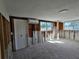 A room during the renovation process, with walls and flooring incomplete at 4021 Eagle Nest Dr, Hernando Beach, FL 34607