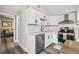 Updated kitchen featuring white cabinets, stainless steel appliances, and subway tile backsplash at 4021 Eagle Nest Dr, Hernando Beach, FL 34607