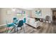 Open living space with modern furnishings and a glass dining table at 4021 Eagle Nest Dr, Hernando Beach, FL 34607