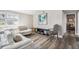 Living room with white sectional sofa and a decorative chair at 4021 Eagle Nest Dr, Hernando Beach, FL 34607