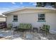 Patio seating area with couches and chairs, in front of the house at 4021 Eagle Nest Dr, Hernando Beach, FL 34607