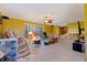 Living room with a ceiling fan and ample space for furniture at 4126 13Th Ne Ln, St Petersburg, FL 33703