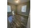Spacious bedroom with wood-look floors and neutral walls at 4315 Berkley Dr, Tampa, FL 33610
