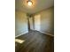 Bright bedroom with wood-look floors and neutral walls at 4315 Berkley Dr, Tampa, FL 33610