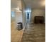 Long hallway with wood-look floors and access to rooms at 4315 Berkley Dr, Tampa, FL 33610