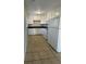 Efficient kitchen with white cabinets and tile flooring at 4315 Berkley Dr, Tampa, FL 33610