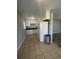 Kitchen with white cabinets, tile floor, and appliances at 4315 Berkley Dr, Tampa, FL 33610
