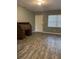 Living room featuring wood-look floors and a classic desk at 4315 Berkley Dr, Tampa, FL 33610