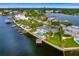 Waterfront home with pool and private dock, aerial view at 5033 W San Miguel St, Tampa, FL 33629