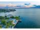 Waterfront home, pool, and dock, aerial perspective at 5033 W San Miguel St, Tampa, FL 33629
