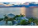 Aerial view showcasing waterfront home, pool, and dock at 5033 W San Miguel St, Tampa, FL 33629