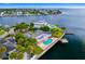 Aerial view of house with pool and dock on the water at 5033 W San Miguel St, Tampa, FL 33629