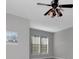 Bedroom with ceiling fan and two windows at 5403 Cafrey Pl, Apollo Beach, FL 33572