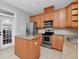 Kitchen with stainless steel appliances and island at 5403 Cafrey Pl, Apollo Beach, FL 33572