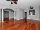 Bright living room with hardwood floors and ceiling fan at 5403 Cafrey Pl, Apollo Beach, FL 33572