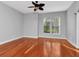 Living room featuring hardwood floors and large windows at 5403 Cafrey Pl, Apollo Beach, FL 33572