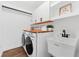 Laundry room with white cabinets, wood countertop, and utility sink at 5472 Cactus Cir, Spring Hill, FL 34606