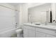 Clean bathroom with double vanity and a bathtub at 5484 Warrington Town Path, Wesley Chapel, FL 33545