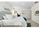 Spacious main bedroom with a plush bed and plenty of natural light at 5484 Warrington Town Path, Wesley Chapel, FL 33545