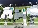 An aerial perspective showcasing the home's location, pool, and proximity to neighboring houses at 560 Riviera Dr, Tampa, FL 33606