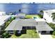 Aerial view of waterfront home with pool and yard at 560 Riviera Dr, Tampa, FL 33606