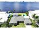 Aerial view of waterfront home with private pool and expansive water views at 560 Riviera Dr, Tampa, FL 33606