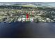 Aerial view of a waterfront property with boat slips at 560 Riviera Dr, Tampa, FL 33606