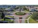 Aerial view of community roundabout and neighborhood homes at 5829 Circa Fishhawk Blvd, Lithia, FL 33547