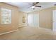 Bedroom featuring a ceiling fan, carpet flooring, and closet at 6922 Hawthorne Trace Ln, Riverview, FL 33578