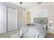 Cozy staged bedroom with carpet, closet, and a comfortable bed at 6922 Hawthorne Trace Ln, Riverview, FL 33578