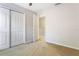 A bright bedroom featuring neutral walls, a large closet, and cozy carpeting at 6922 Hawthorne Trace Ln, Riverview, FL 33578