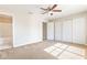 Bedroom with carpet, ceiling fan, and an attached bathroom at 6922 Hawthorne Trace Ln, Riverview, FL 33578