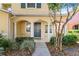 Home's front entrance with a walkway and landscaping at 6922 Hawthorne Trace Ln, Riverview, FL 33578