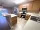 Bright kitchen features stainless steel appliances, plenty of counter space, and a breakfast bar at 6922 Hawthorne Trace Ln, Riverview, FL 33578