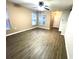 Inviting living room features beautiful floors, bright windows, and a welcoming front door at 6922 Hawthorne Trace Ln, Riverview, FL 33578