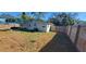 Large backyard with wooden fence at 7045 Lenox Dr, New Port Richey, FL 34653
