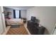 Bright bedroom with a double bed and dresser at 7045 Lenox Dr, New Port Richey, FL 34653