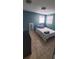 Cozy bedroom with double bed, window, and tiled floor at 7045 Lenox Dr, New Port Richey, FL 34653