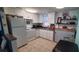 Clean, well-lit kitchen with white cabinets and modern appliances at 7045 Lenox Dr, New Port Richey, FL 34653