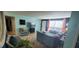 Bright living room with sectional sofa, and view into kitchen at 7045 Lenox Dr, New Port Richey, FL 34653