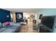 Open living room and kitchen with blue and teal decor at 7045 Lenox Dr, New Port Richey, FL 34653