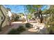 Landscaped backyard with brick patio and fire pit at 7825 Gulf Blvd, St Pete Beach, FL 33706